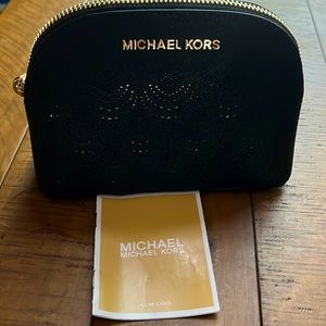 Never used, Michael Kors, clutch or cosmetic case, in black w/ gold underlay